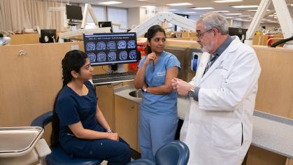 dentist speaking with assistants