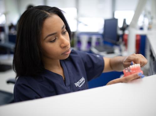 student making dentures